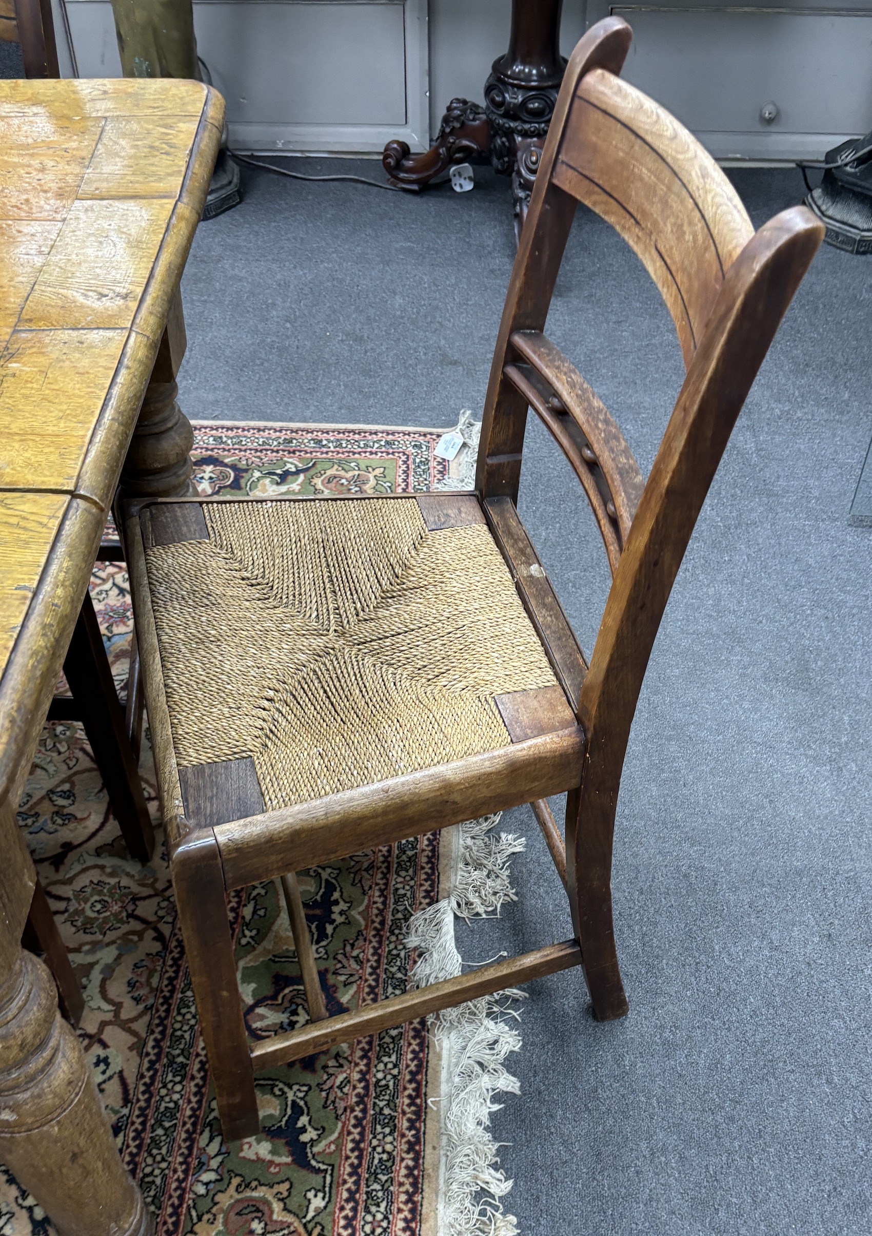 A set of nine early 19th century Provincial mahogany rush seat dining chairs, width 47cm, depth 38cm, height 86cm